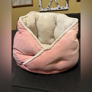 Plush cozy hug me pet bed. Light pink size for small dogs